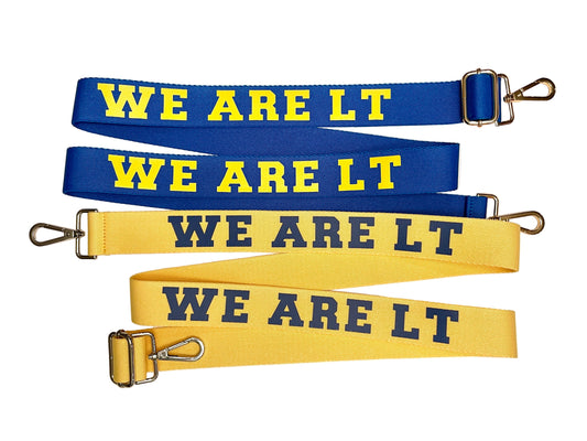 Four fabric straps with 'WE ARE LT' text on a beige background